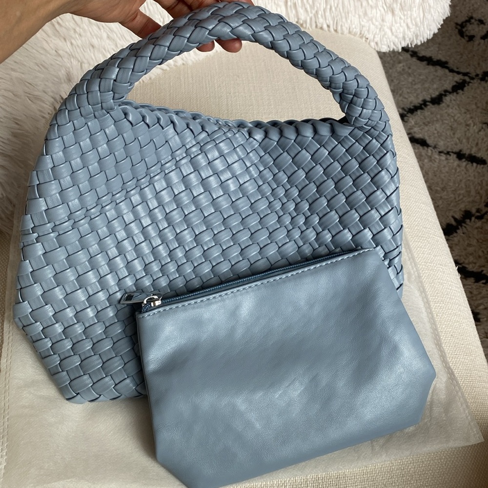 Woven vegan leather tote in Light Blue. Like new condition. FREE cosmetic pouch.